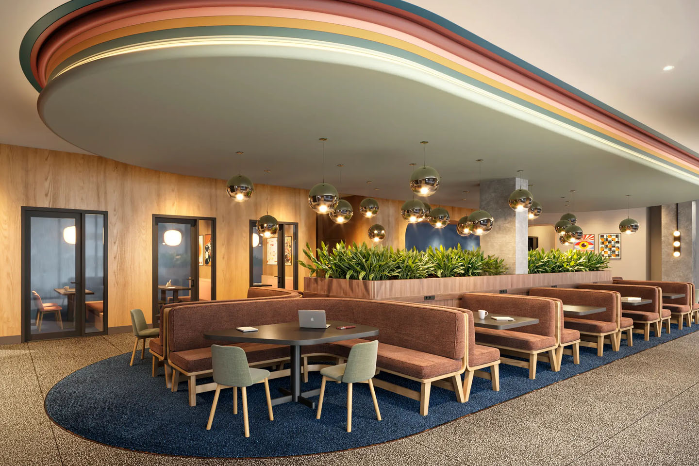 Study area with several booths, tables, and ambient lighting.